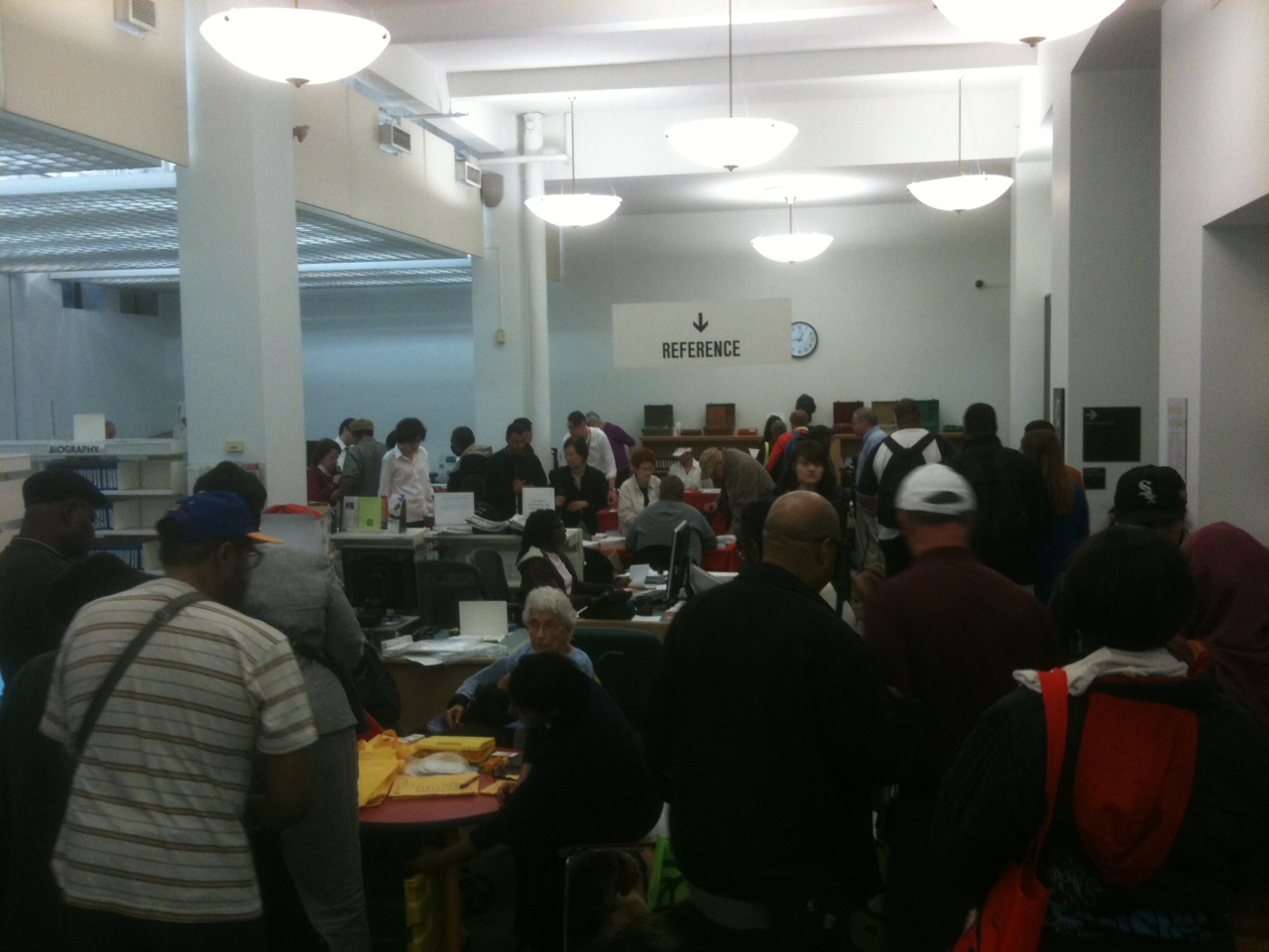 One of our main rooms filled with crowds gathered around vendor tables.